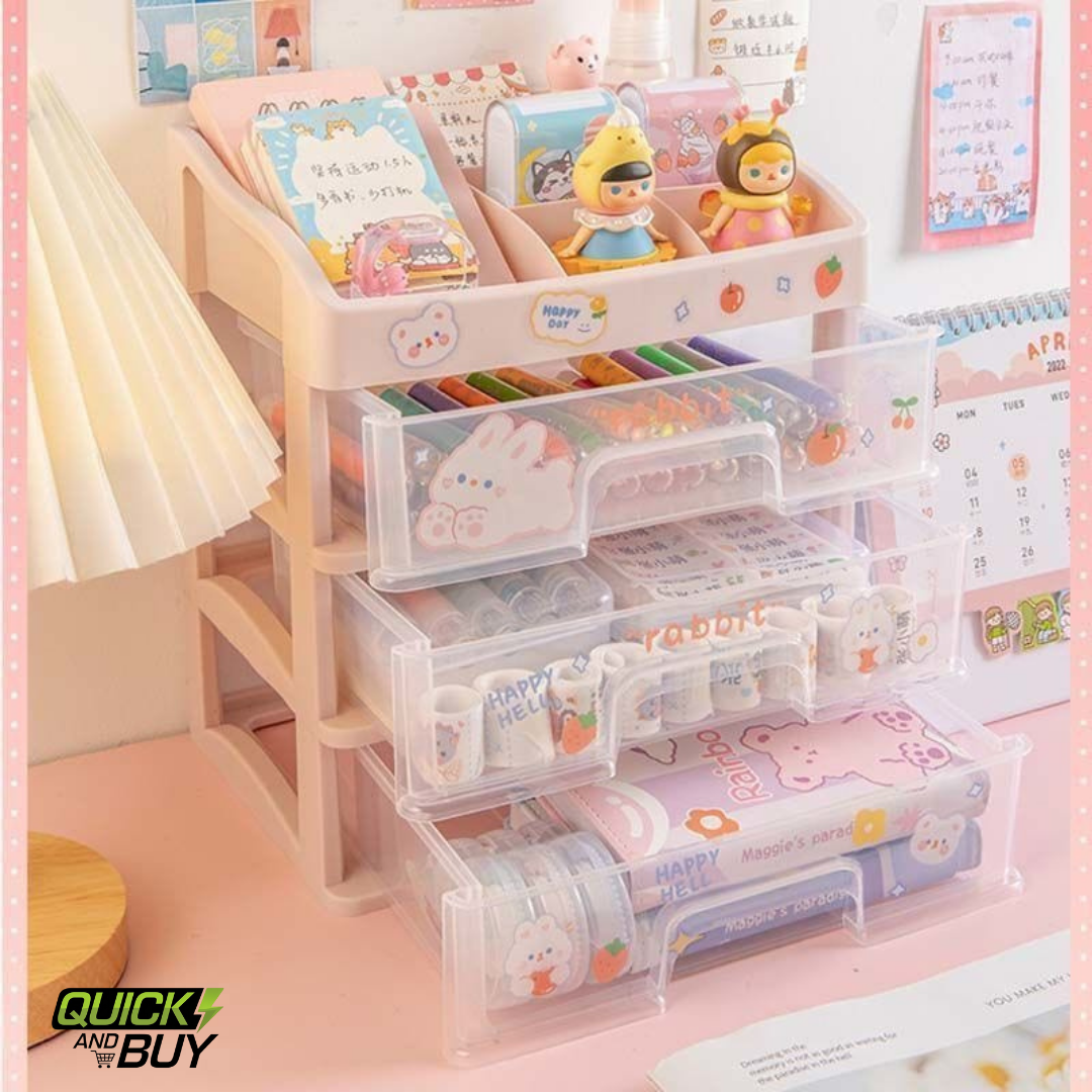 Clear plastic drawers with stationery items on a pink desk, featuring the brand 'Quick and Buy'.